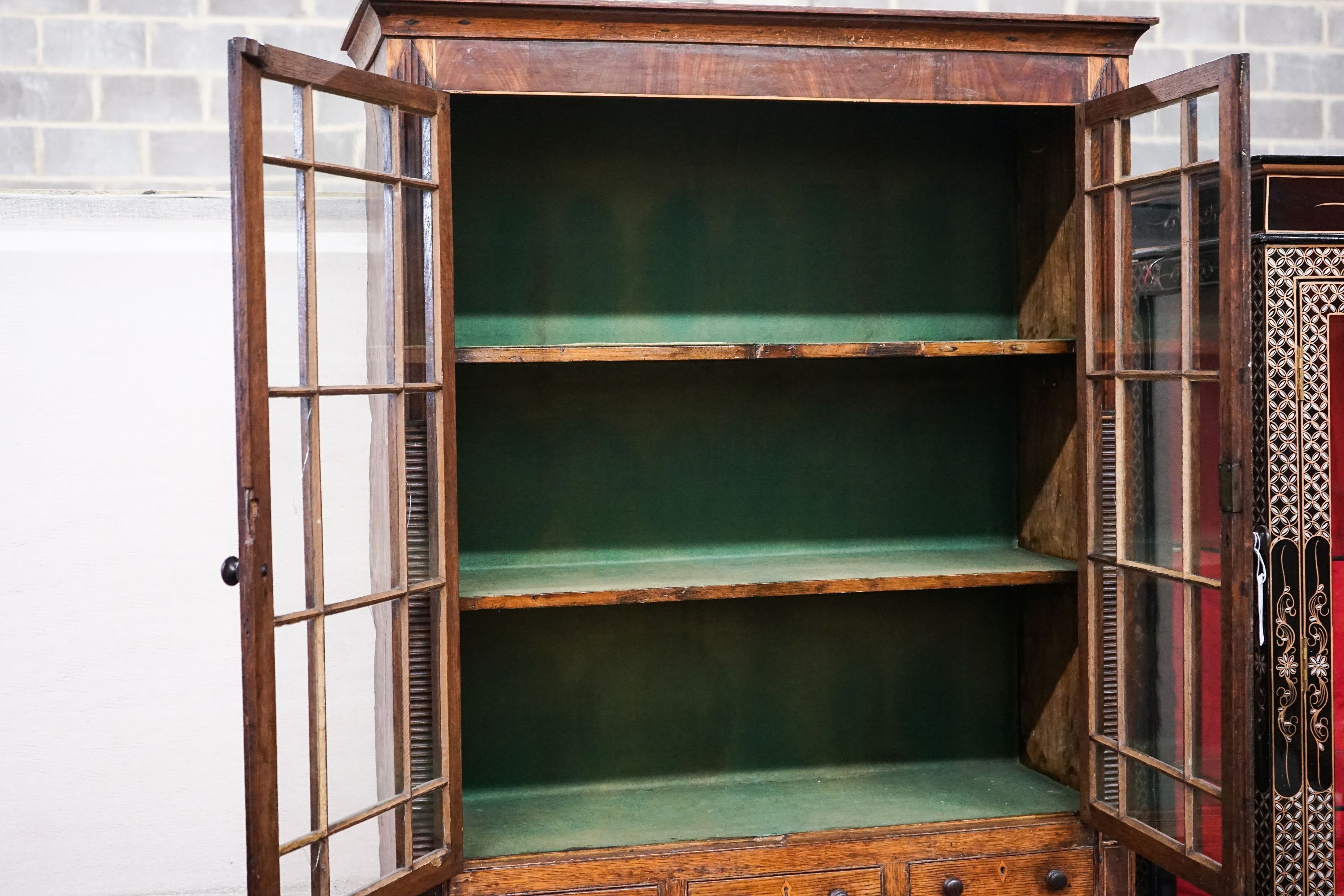 A George IV oak and mahogany bookcase on chest, width 97cm, depth 47cm, height 202cm